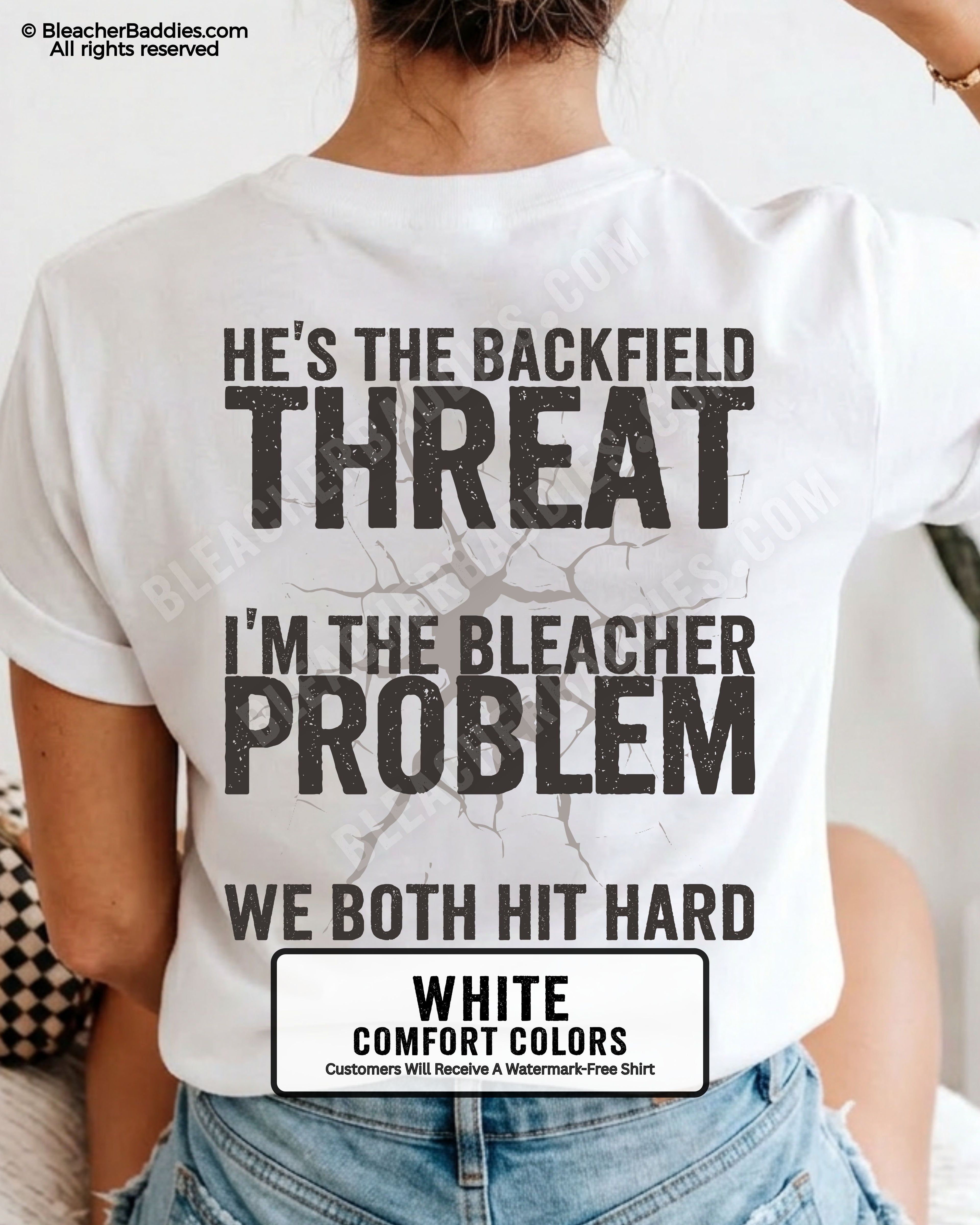 Back view of football mom wearing white Comfort Colors game day shirt with “He’s the Backfield Threat I’m the Bleacher Problem We Both Hit Hard” graphic design