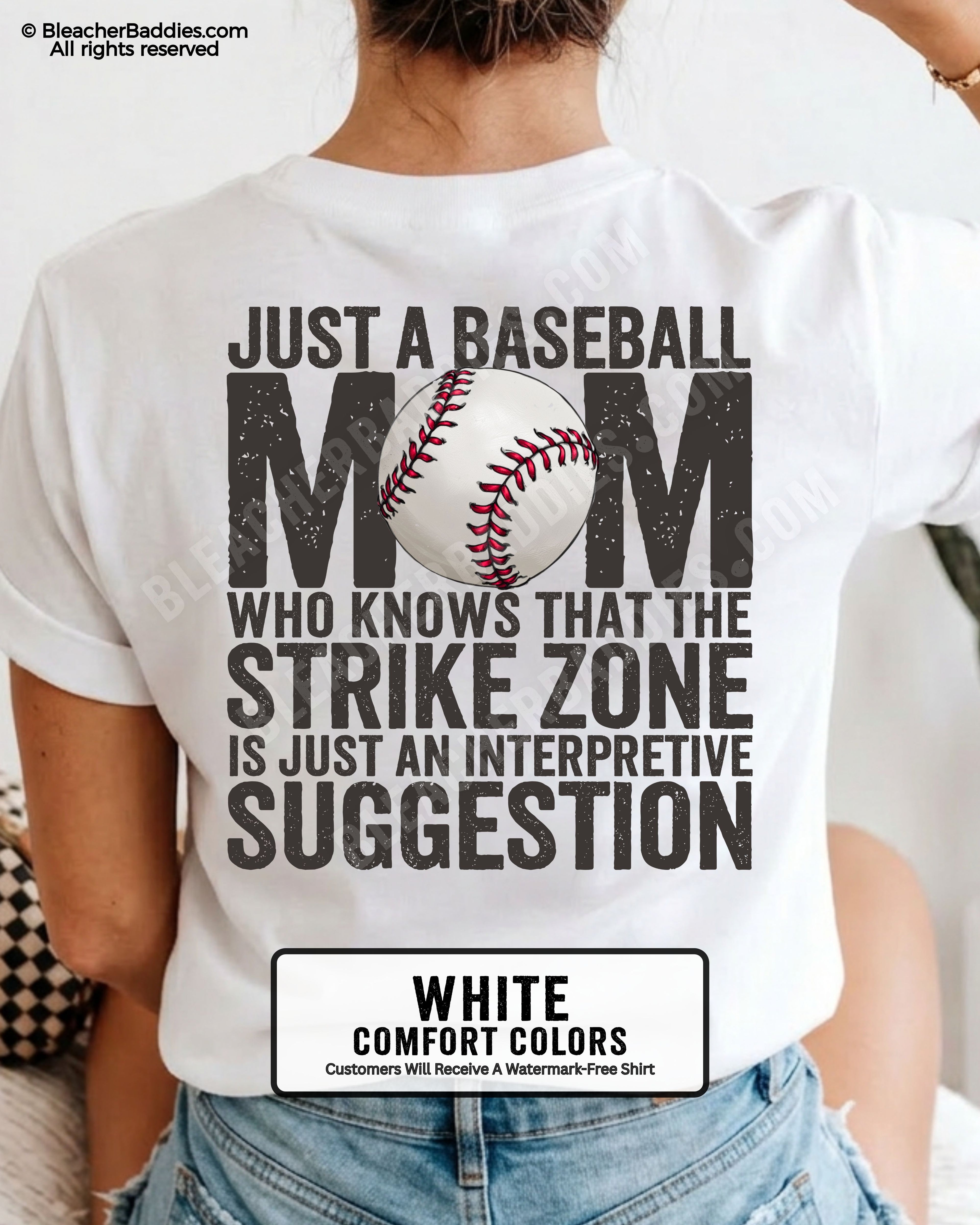 White Comfort Colors game day shirt worn by woman showing distressed back graphic reading “Just a Baseball Mom Who Knows That The Strike Zone Is Just An Interpretive Suggestion” with baseball illustration layered over MOM text