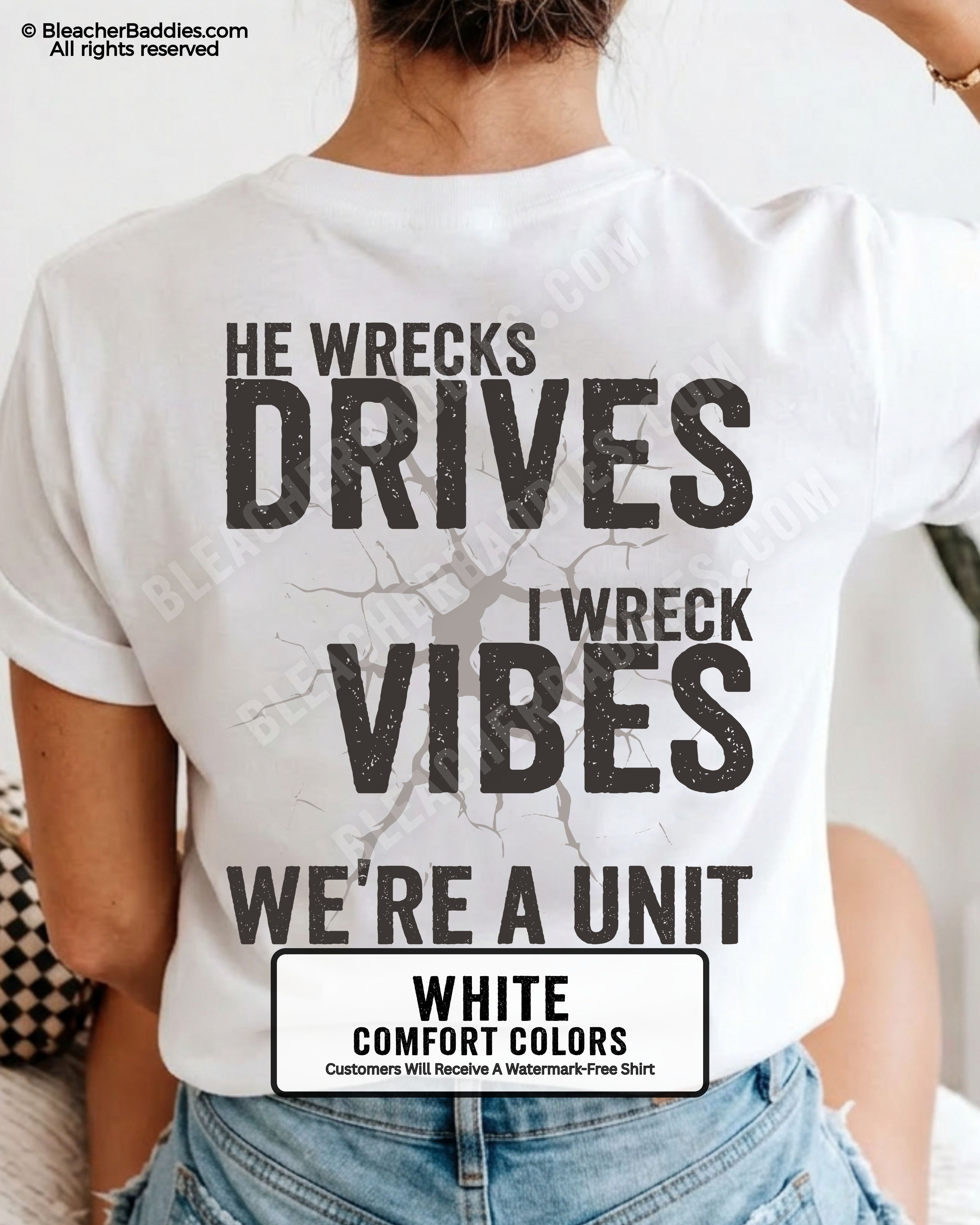 Woman wearing a white Comfort Colors t-shirt shown from the back featuring a large distressed black graphic that reads “He Wrecks Drives I Wreck Vibes We’re a Unit.”