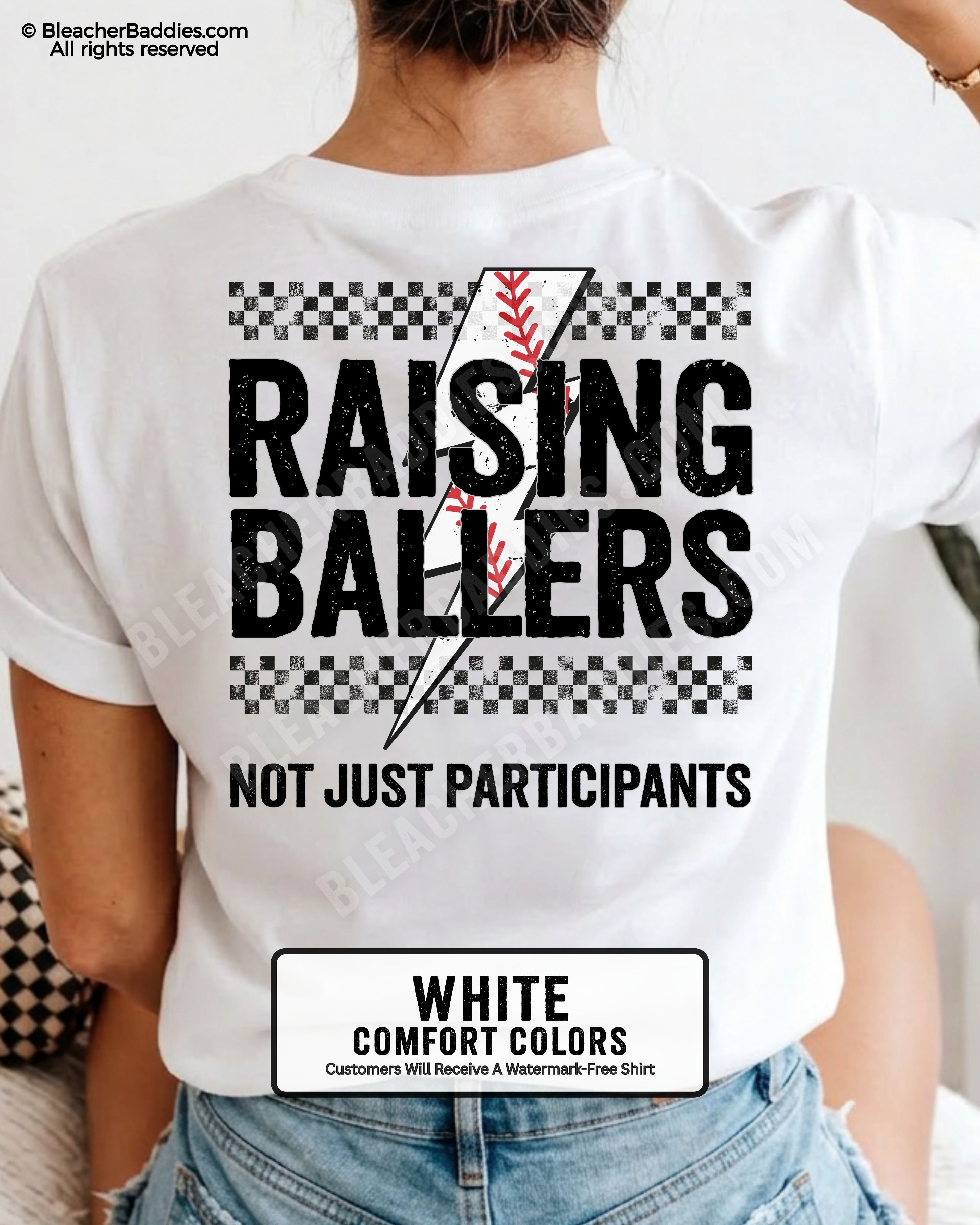 White Comfort Colors baseball game day shirt featuring oversized distressed Raising Ballers text, black checkerboard accents, red baseball stitching graphic, and “Not Just Participants” slogan on back print.