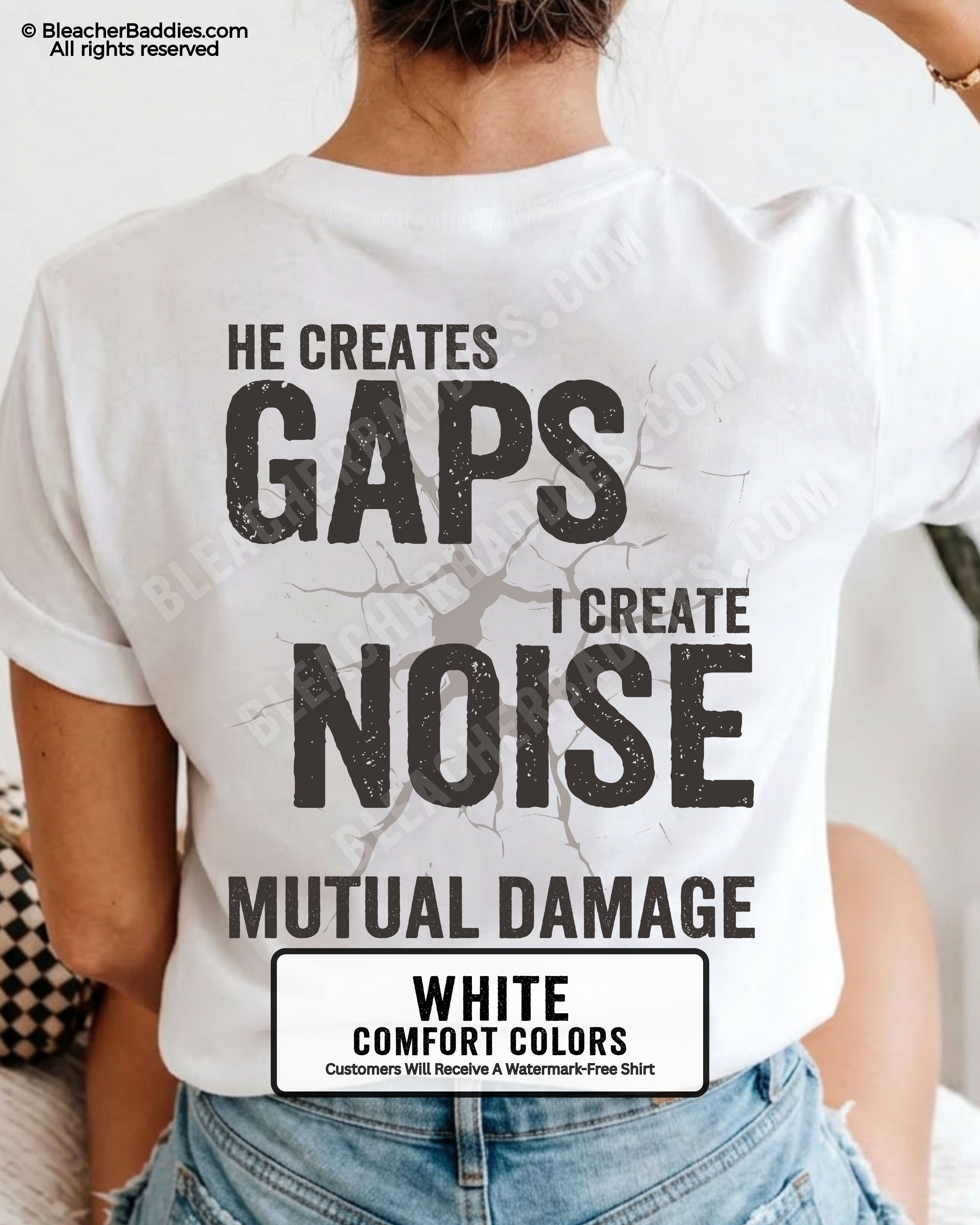 Woman wearing WHITE Comfort Colors football mom game day shirt with back design that reads “He creates gaps I create noise mutual damage” in distressed black text with cracked graphic and chambray color label shown