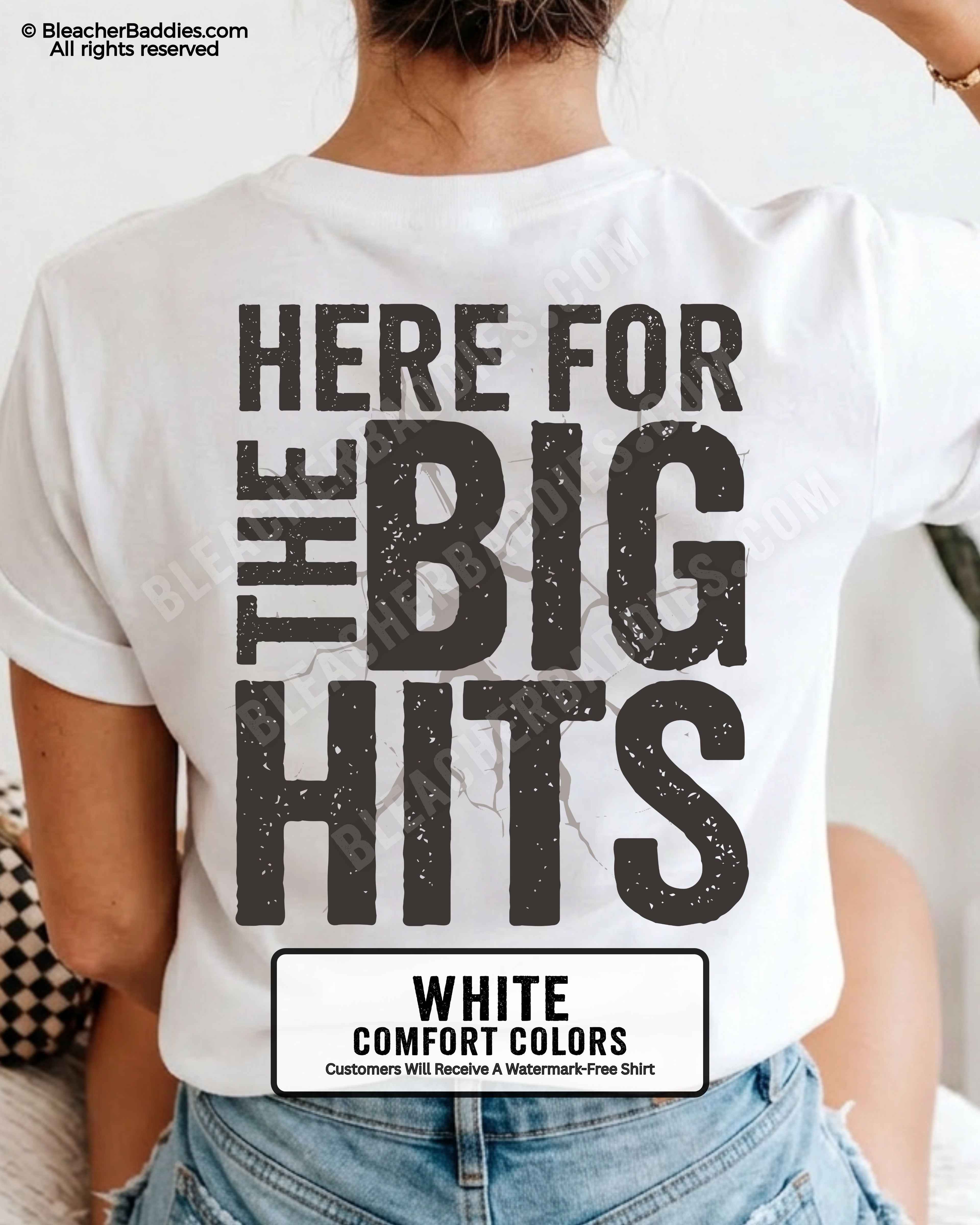 White Comfort Colors baseball mom graphic tee with oversized distressed typography reading “Here For The Big Hits” across the back