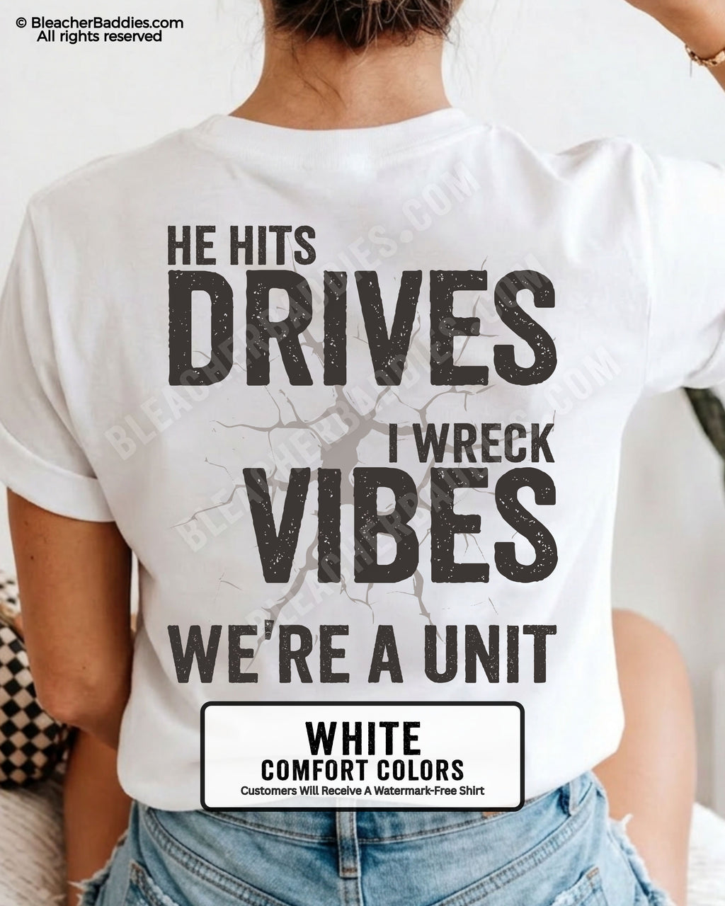 White Comfort Colors baseball mom shirt featuring oversized distressed back graphic reading “He Hits Drives I Wreck Vibes We’re A Unit” with cracked background detail and vintage sports mom aesthetic.