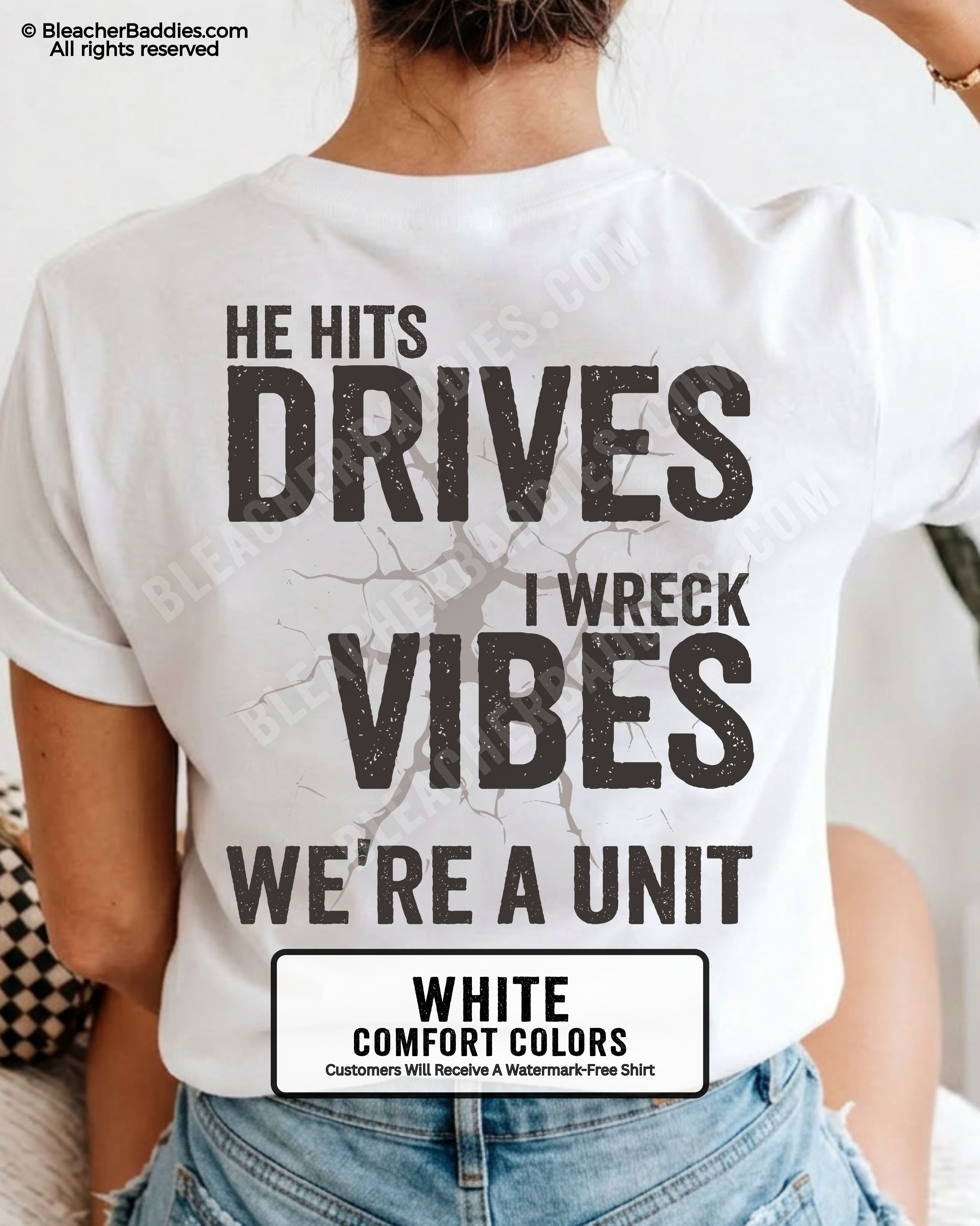 White Comfort Colors baseball mom shirt featuring oversized distressed back graphic reading “He Hits Drives I Wreck Vibes We’re A Unit” with cracked background detail and vintage sports mom aesthetic.