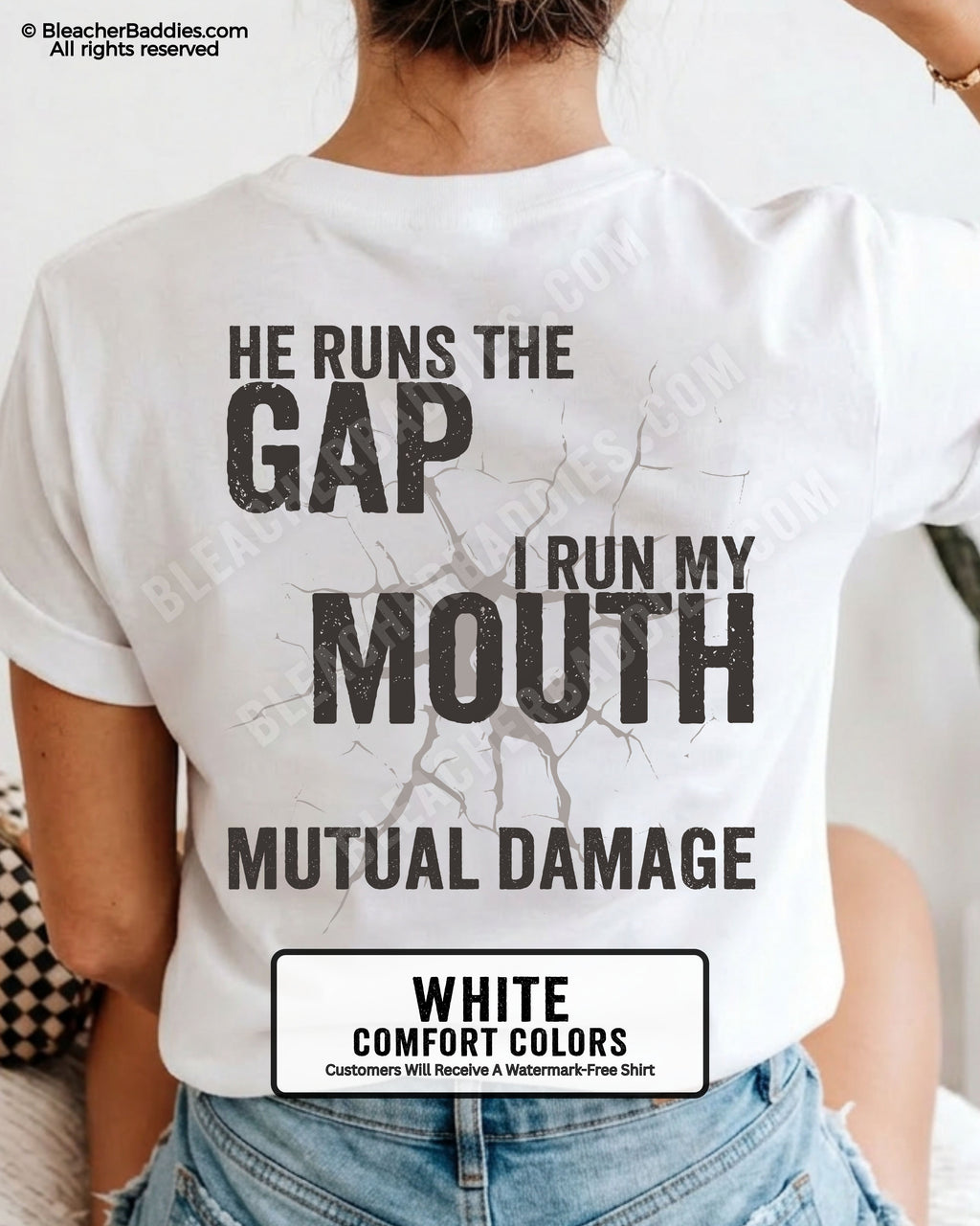 Back view of football mom wearing white Comfort Colors game day shirt with “He Runs the Gap I Run My Mouth Mutual Damage” graphic design