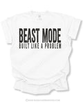 White Comfort Colors football game day shirt with distressed black “BEAST MODE BUILT LIKE A PROBLEM” graphic displayed on a flat lay mockup against a light background.