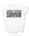 Flat lay mockup of a white Comfort Colors football game day shirt featuring distressed black text that reads “Conditioning Survivor” on a neutral gray background with BleacherBaddies.com watermark across the design.