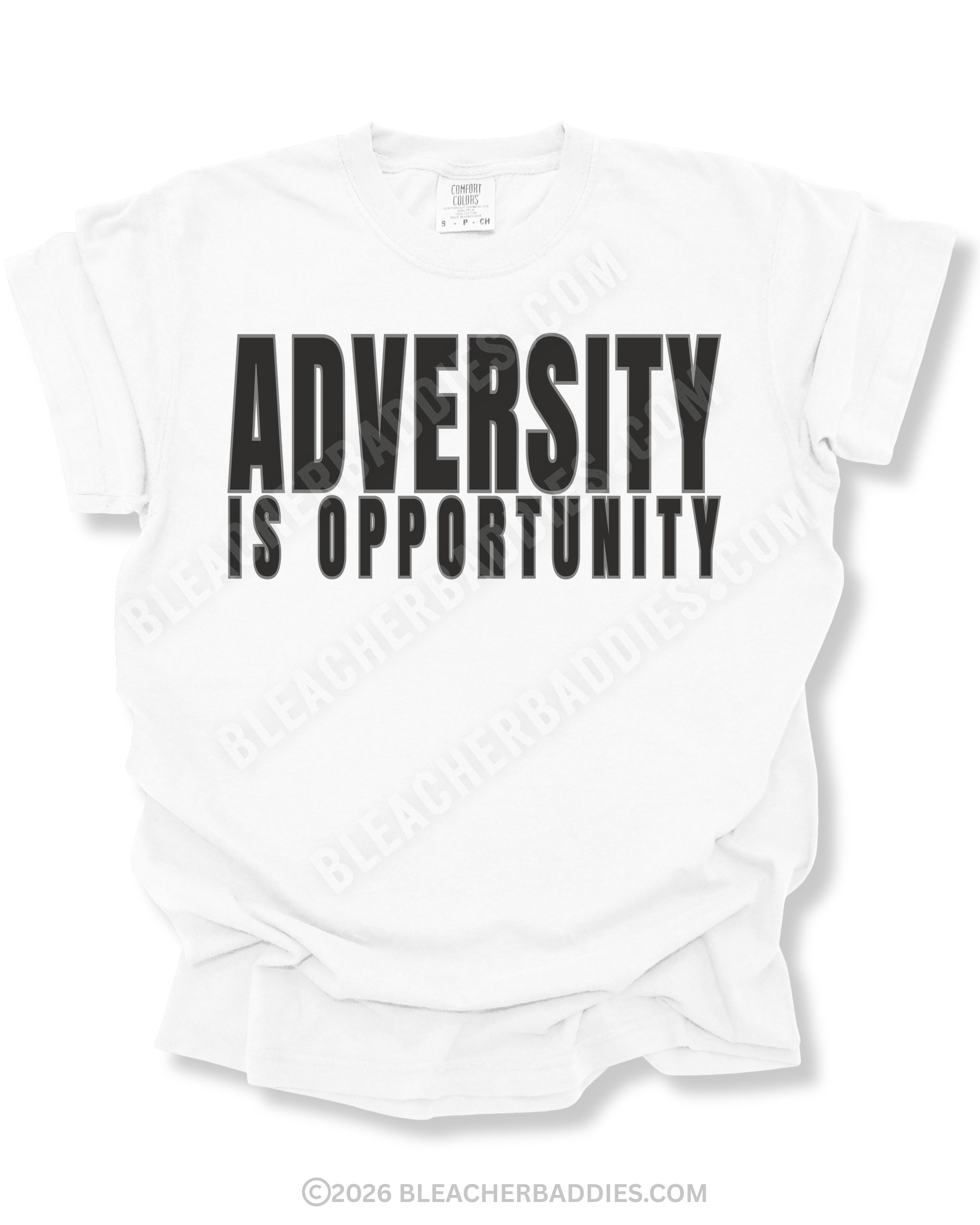 White graphic t-shirt featuring bold black “ADVERSITY IS OPPORTUNITY” text centered on the front of a relaxed fit short sleeve athletic shirt against a neutral background.