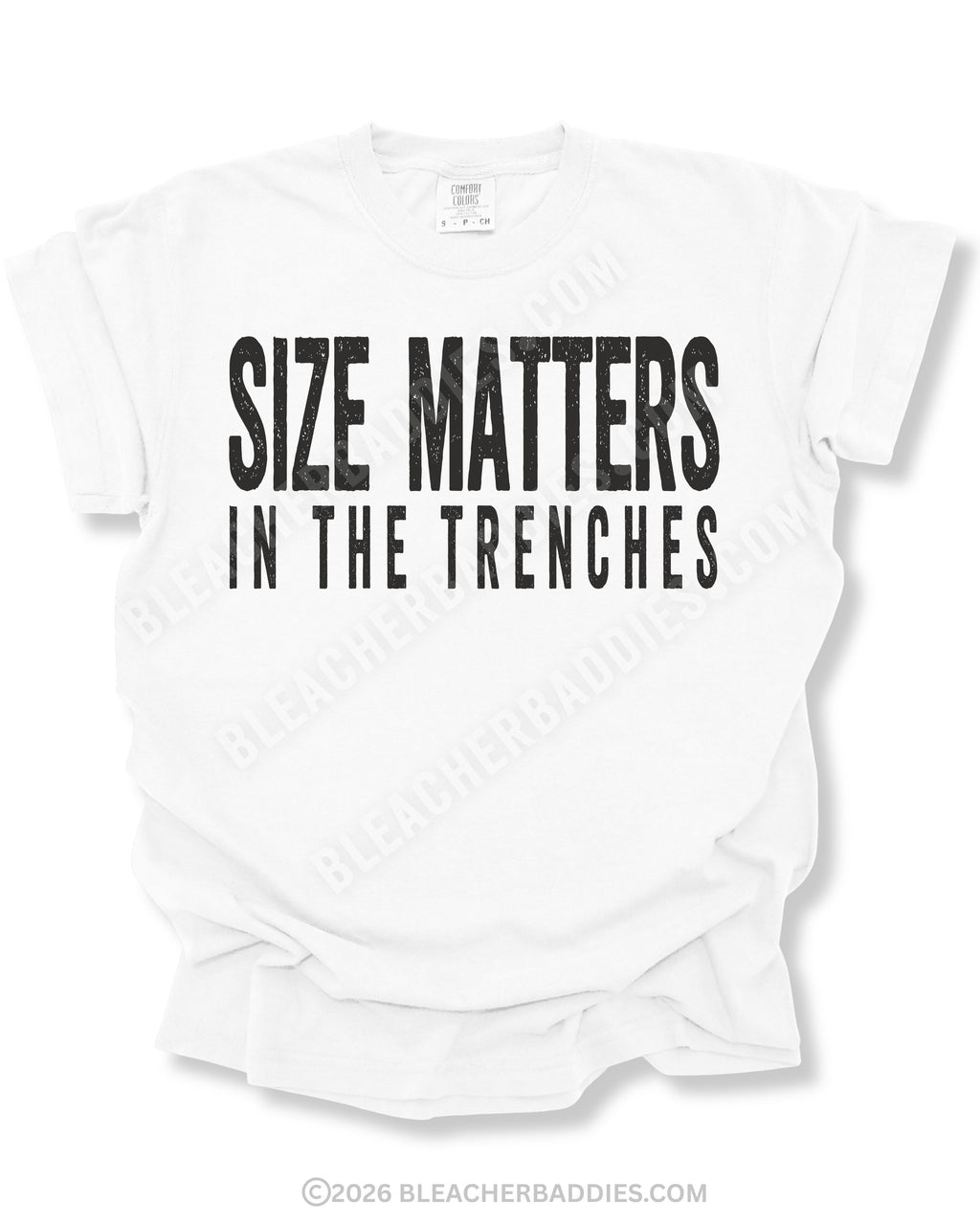 White Comfort Colors football game day shirt flat lay featuring distressed black “Size Matters In The Trenches” typography designed for offensive and defensive linemen.