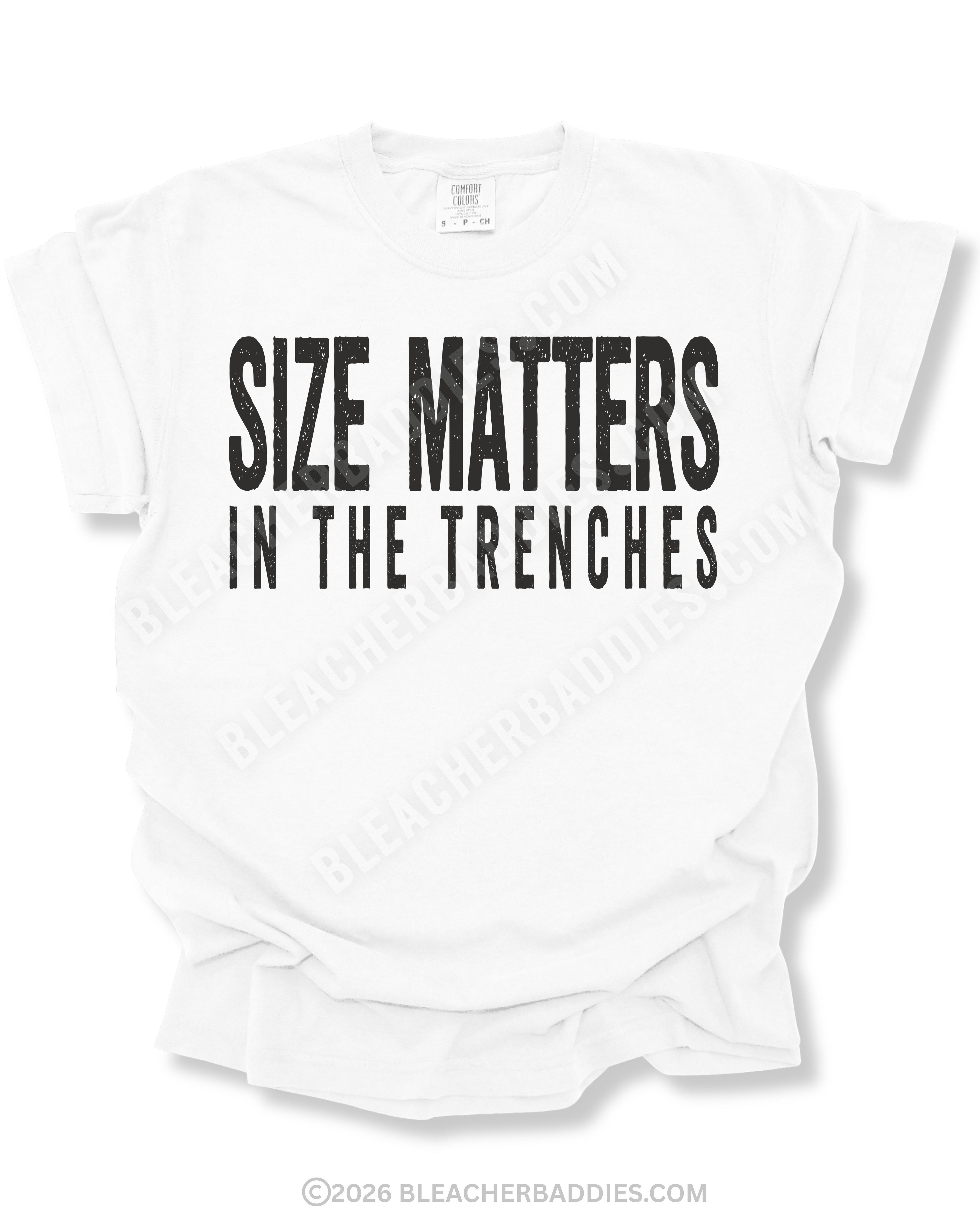 White Comfort Colors football game day shirt flat lay featuring distressed black “Size Matters In The Trenches” typography designed for offensive and defensive linemen.