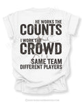 White baseball mom game day shirt with distressed oversized typography reading “He Works The Counts I Work The Crowd Same Team Different Players”