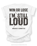 White Comfort Colors style shirt mockup with distressed black typography reading “Win Or Lose I’m Still Loud” with cracked grunge background graphic and #AudiblyCommitted phrase on back design.