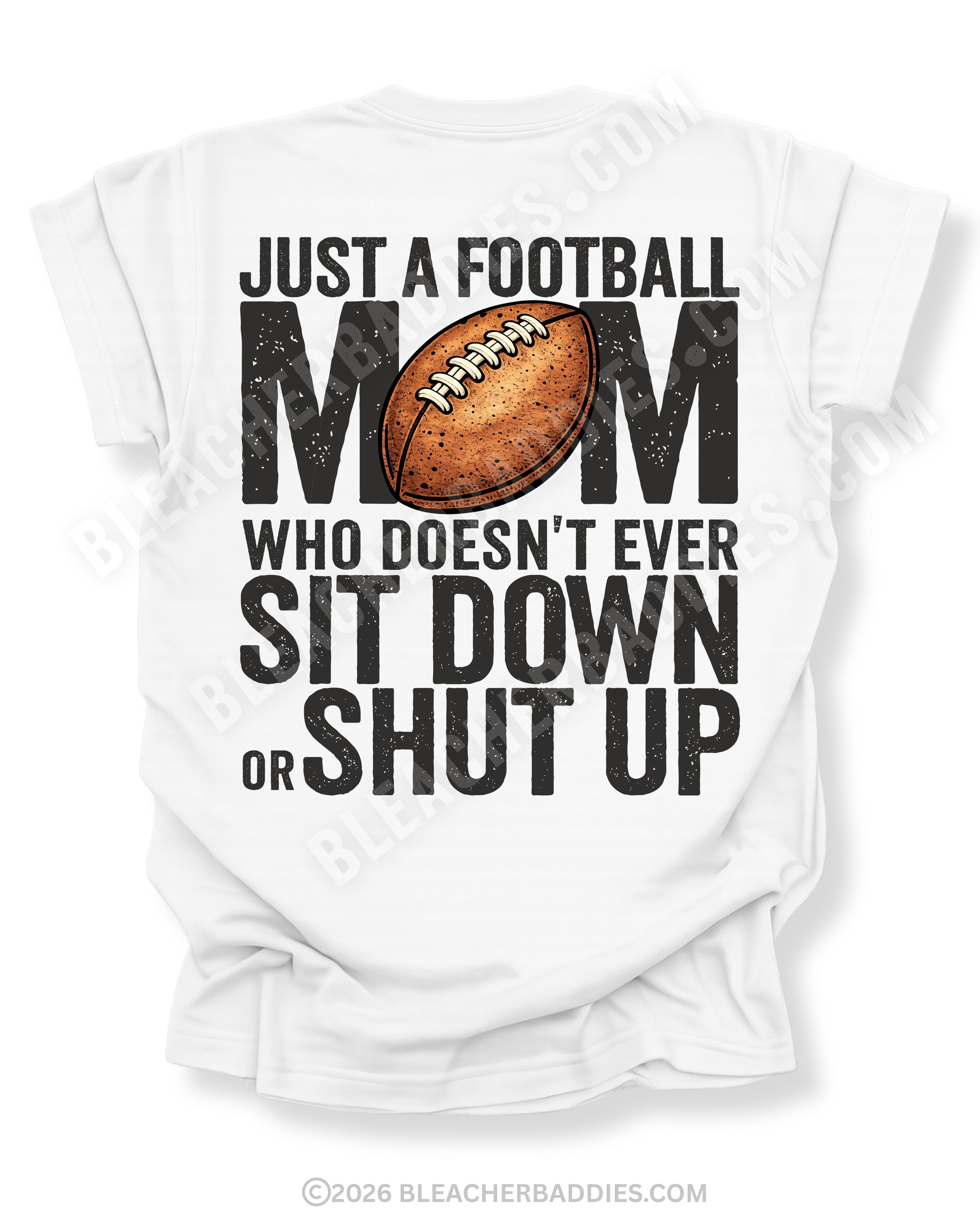 White Comfort Colors t-shirt with bold black back graphic reading “Just a Football Mom Who Doesn’t Ever Sit Down or Shut Up” with a football illustration centered in the design