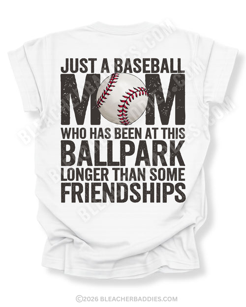 White game day shirt with oversized distressed back graphic reading “Just a Baseball Mom Who Has Been at This Ballpark Longer Than Some Friendships” with baseball graphic layered over MOM text