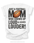 White Comfort Colors football mom game day shirt featuring large back design with text “Just a football mom who shows up loud & leaves louder” and football illustration