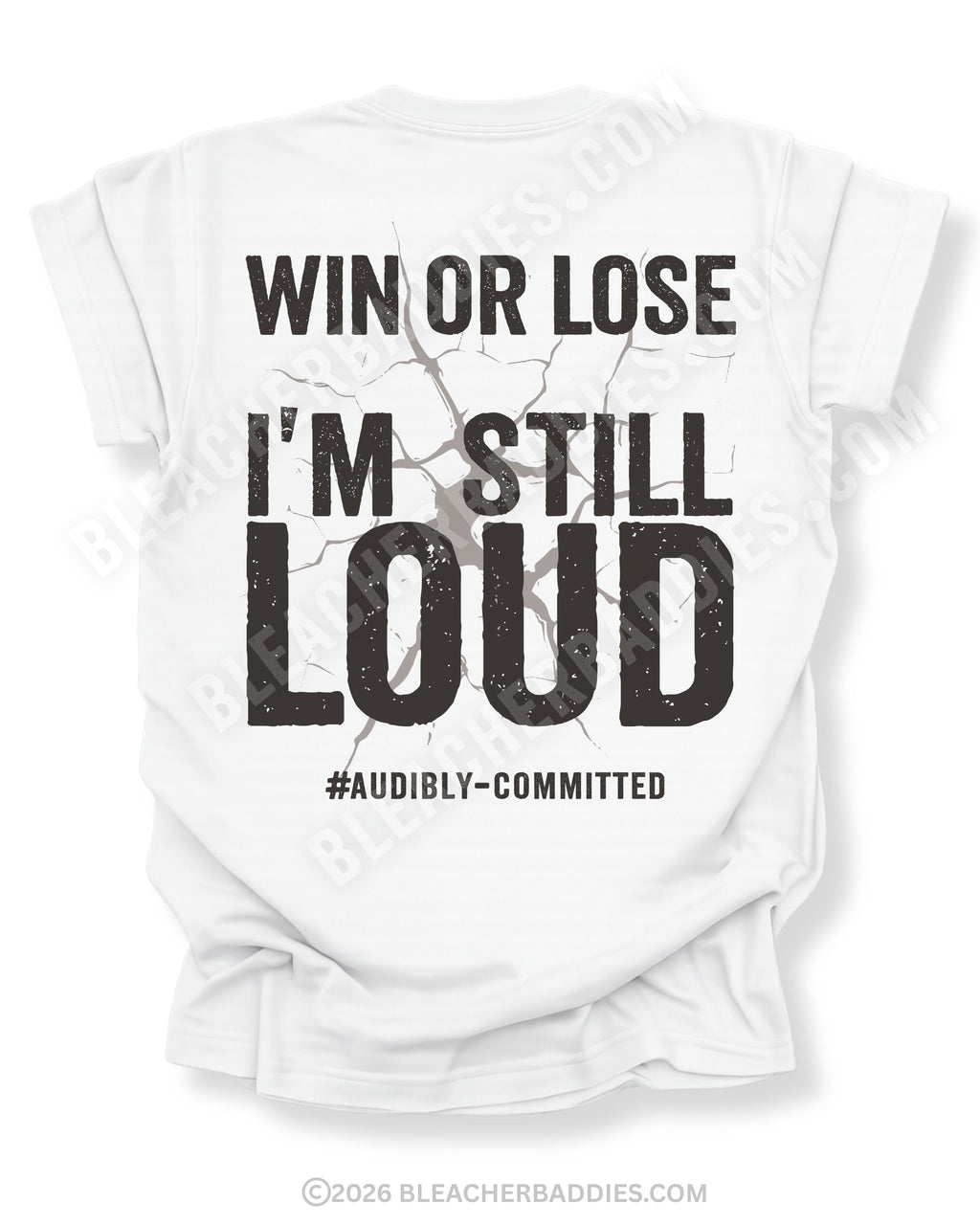 White t-shirt shown from the back featuring a large distressed black graphic that reads “Win or Lose I’m Still Loud #Audibly Committed” with a cracked texture effect.