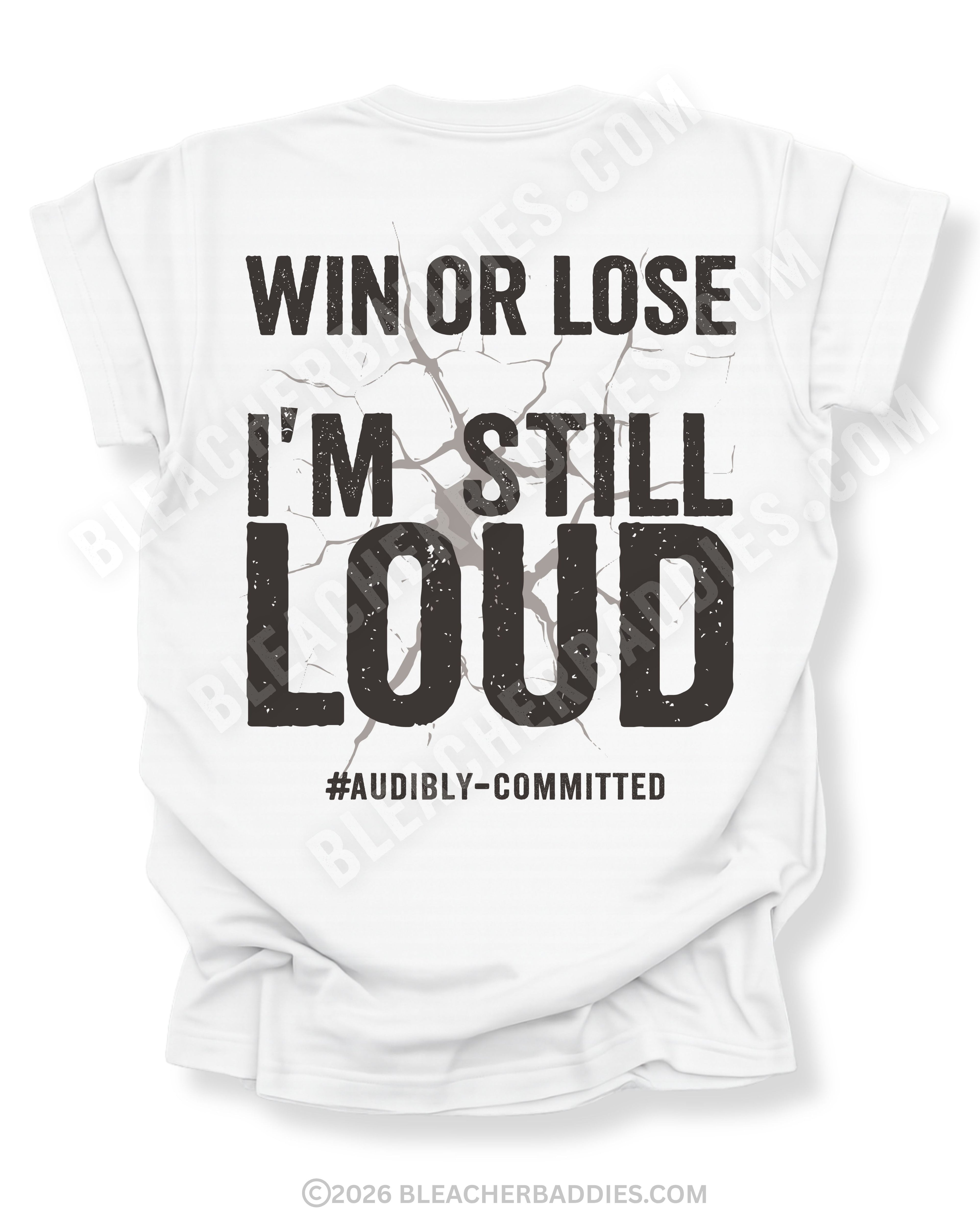 White t-shirt shown from the back featuring a large distressed black graphic that reads “Win or Lose I’m Still Loud #Audibly Committed” with a cracked texture effect.