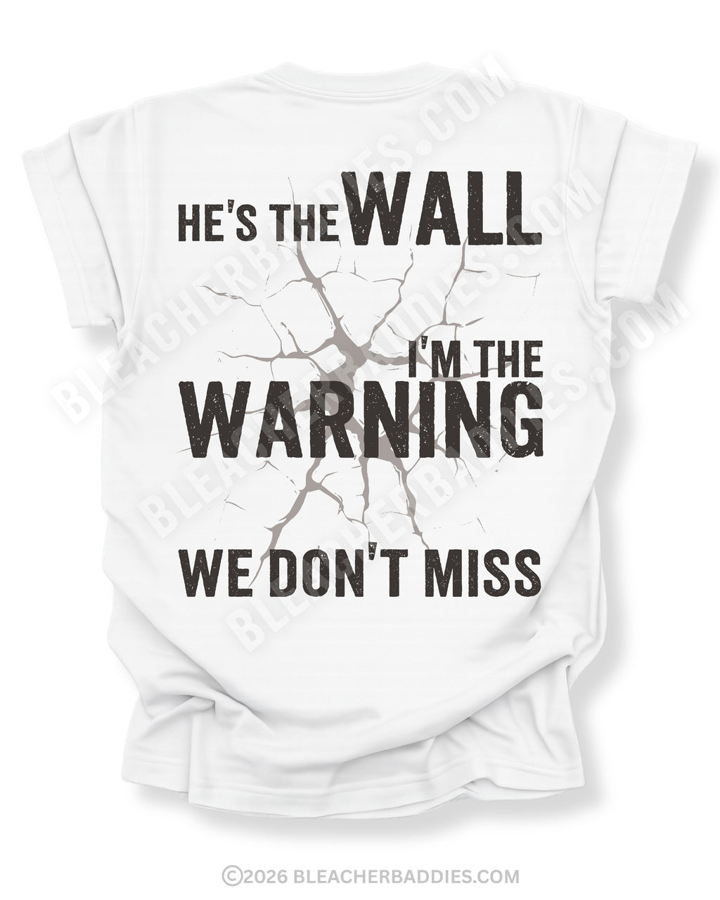 White football mom game day shirt shown from the back featuring a large distressed black graphic that reads “He’s the Wall I’m the Warning We Don’t Miss.”