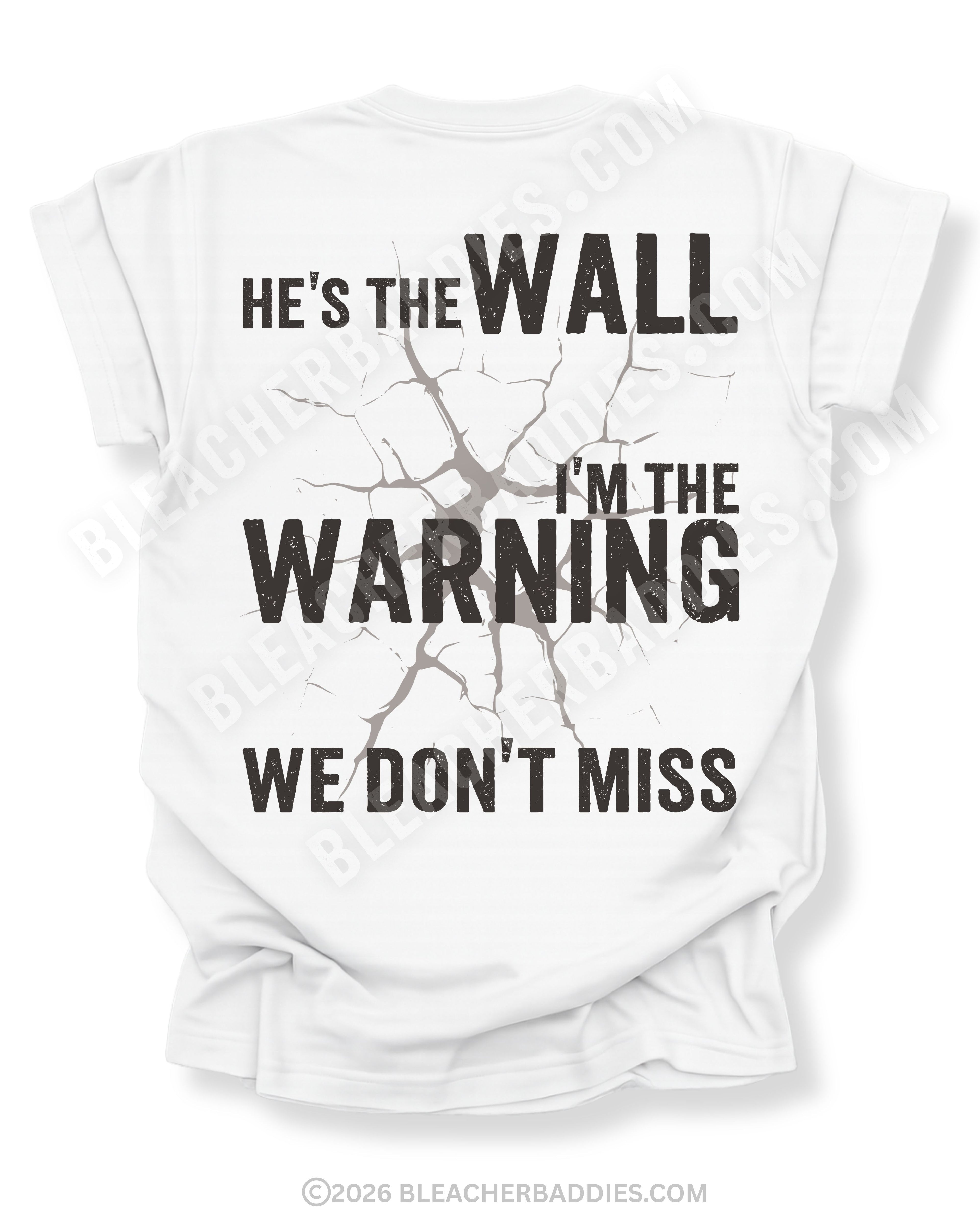 White football mom game day shirt shown from the back featuring a large distressed black graphic that reads “He’s the Wall I’m the Warning We Don’t Miss.”