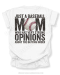 White Comfort Colors game day shirt with distressed back graphic reading “Just a Baseball Mom Who Has Very Strong Opinions About The Batting Order” with baseball graphic layered over MOM text