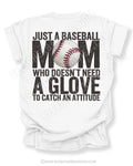 White Comfort Colors game day shirt with distressed back graphic reading “Just a Baseball Mom Who Doesn’t Need A Glove To Catch An Attitude” with baseball graphic layered over MOM text