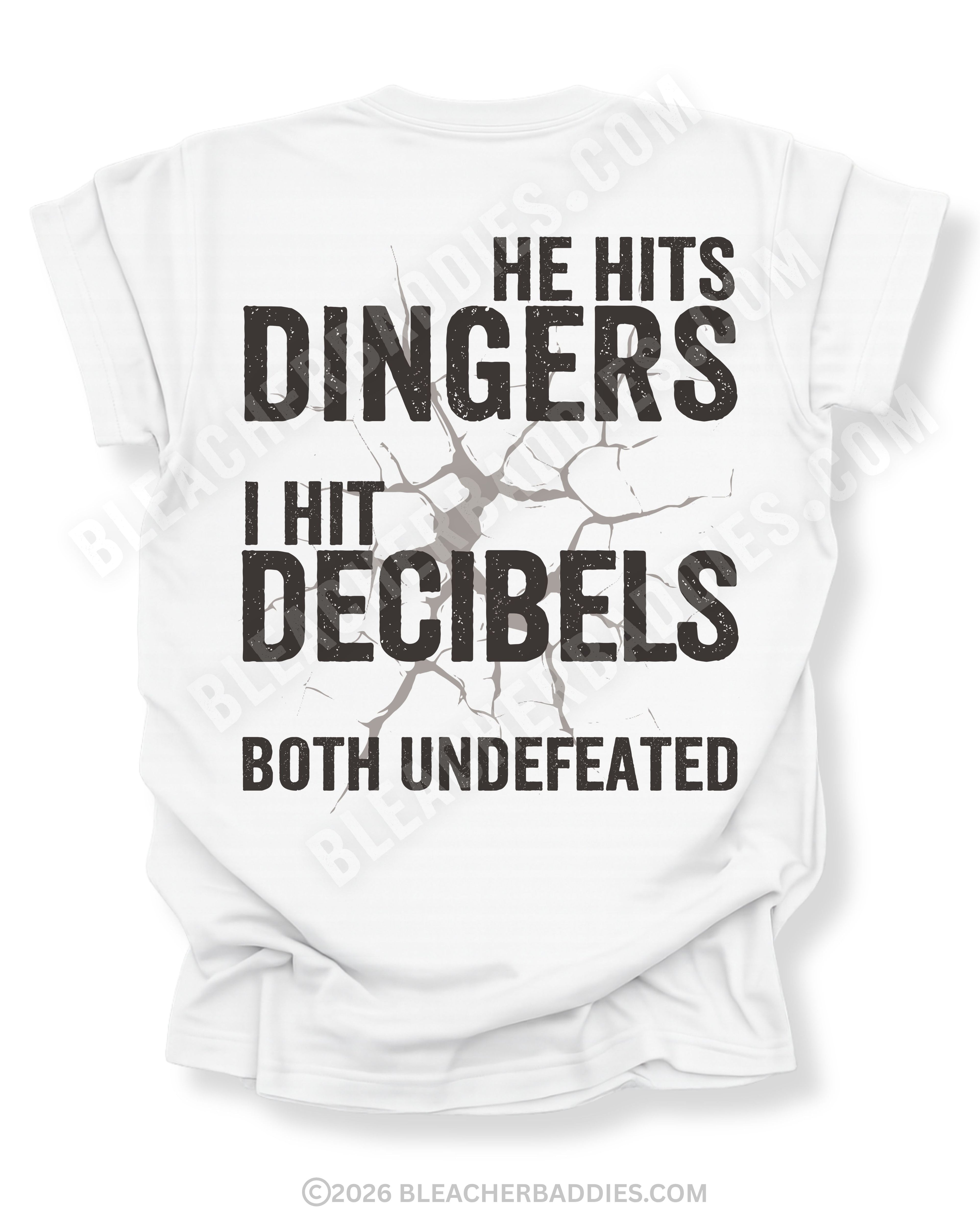 White Comfort Colors baseball mom game day shirt with distressed oversized typography reading “He Hits Dingers I Hit Decibels Both Undefeated” across the back