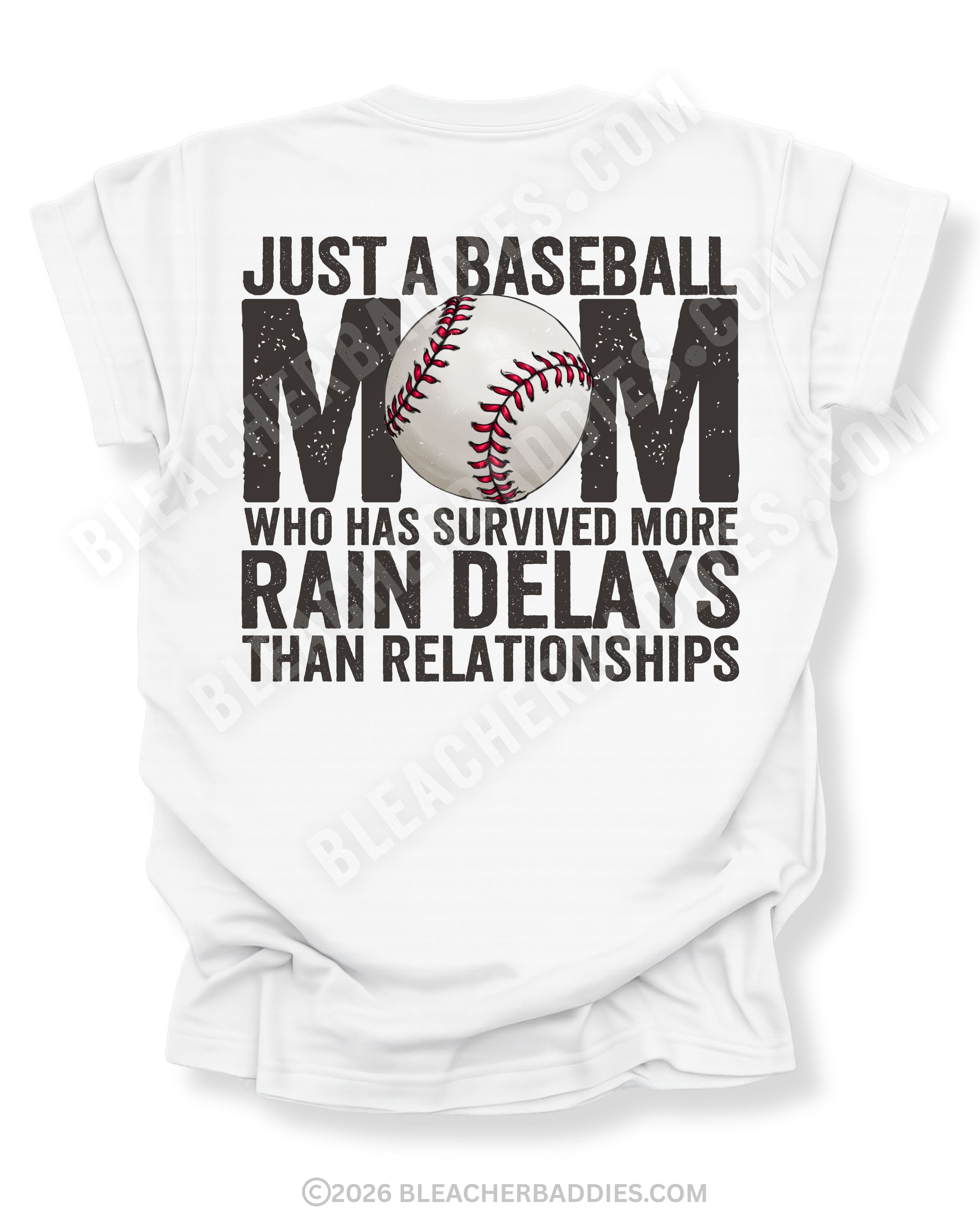 White Comfort Colors game day shirt with distressed back graphic reading “Just a Baseball Mom Who Has Survived More Rain Delays Than Relationships” with baseball graphic layered over MOM text