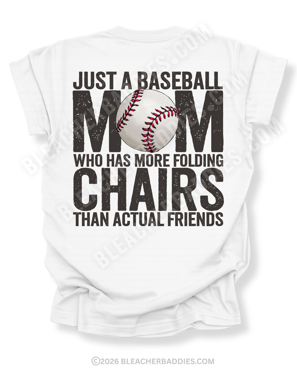 White Comfort Colors baseball mom game day shirt with distressed black text reading “Just a baseball mom who has more folding chairs than actual friends” and baseball graphic replacing the O in MOM