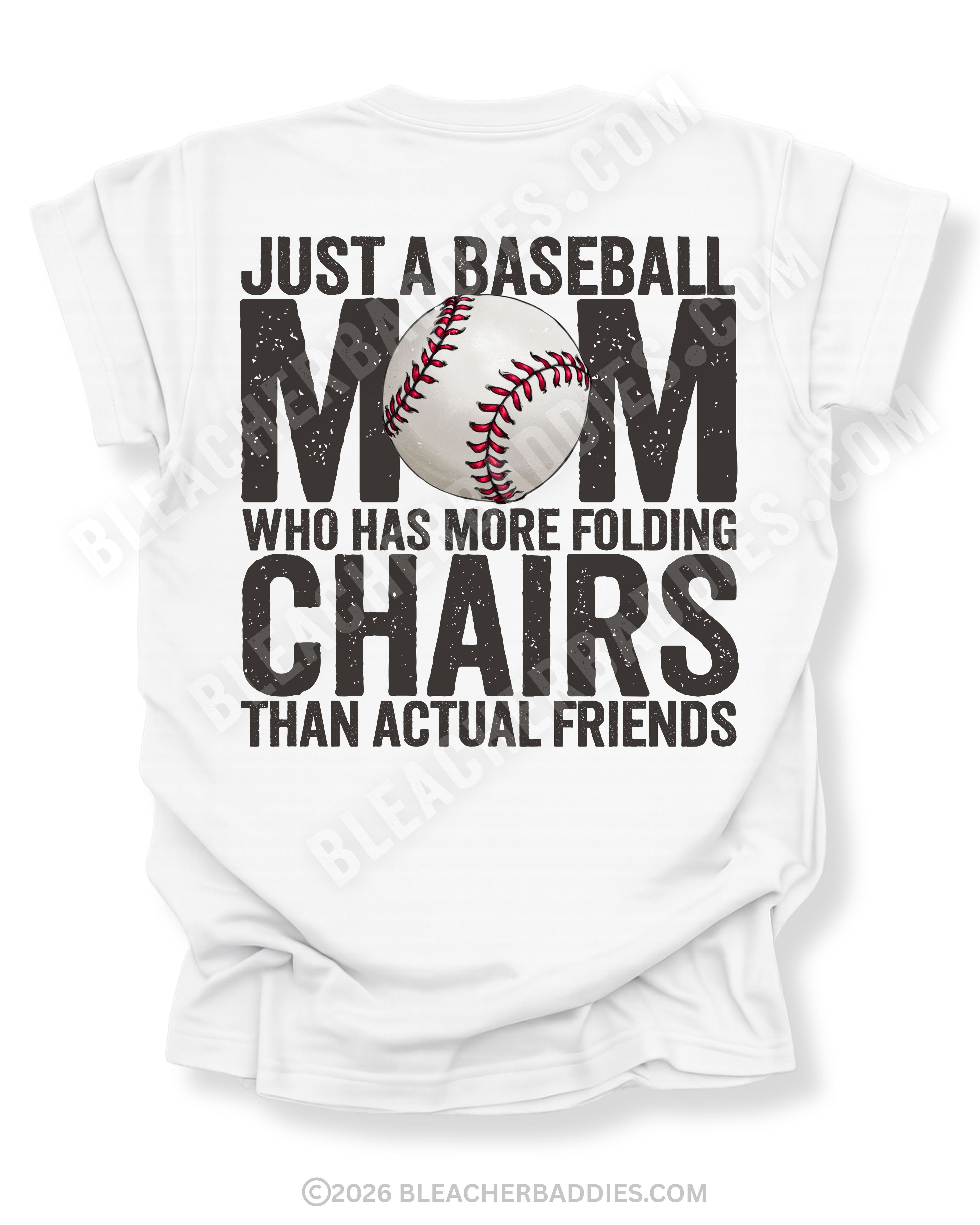 White Comfort Colors baseball mom game day shirt with distressed black text reading “Just a baseball mom who has more folding chairs than actual friends” and baseball graphic replacing the O in MOM