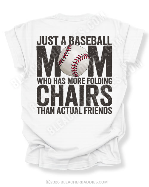 White Comfort Colors baseball mom game day shirt with distressed black text reading “Just a baseball mom who has more folding chairs than actual friends” and baseball graphic replacing the O in MOM