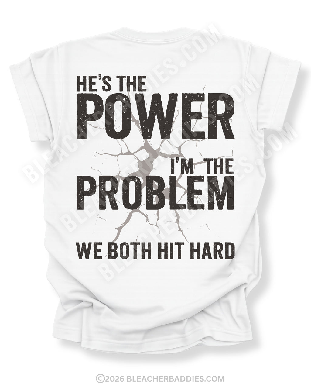 Back view of ivory Comfort Colors football mom game day shirt reading “He’s the Power I’m the Problem We Both Hit Hard,” worn by woman in stadium seating