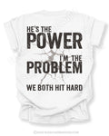 Back view of ivory Comfort Colors football mom game day shirt reading “He’s the Power I’m the Problem We Both Hit Hard,” worn by woman in stadium seating
