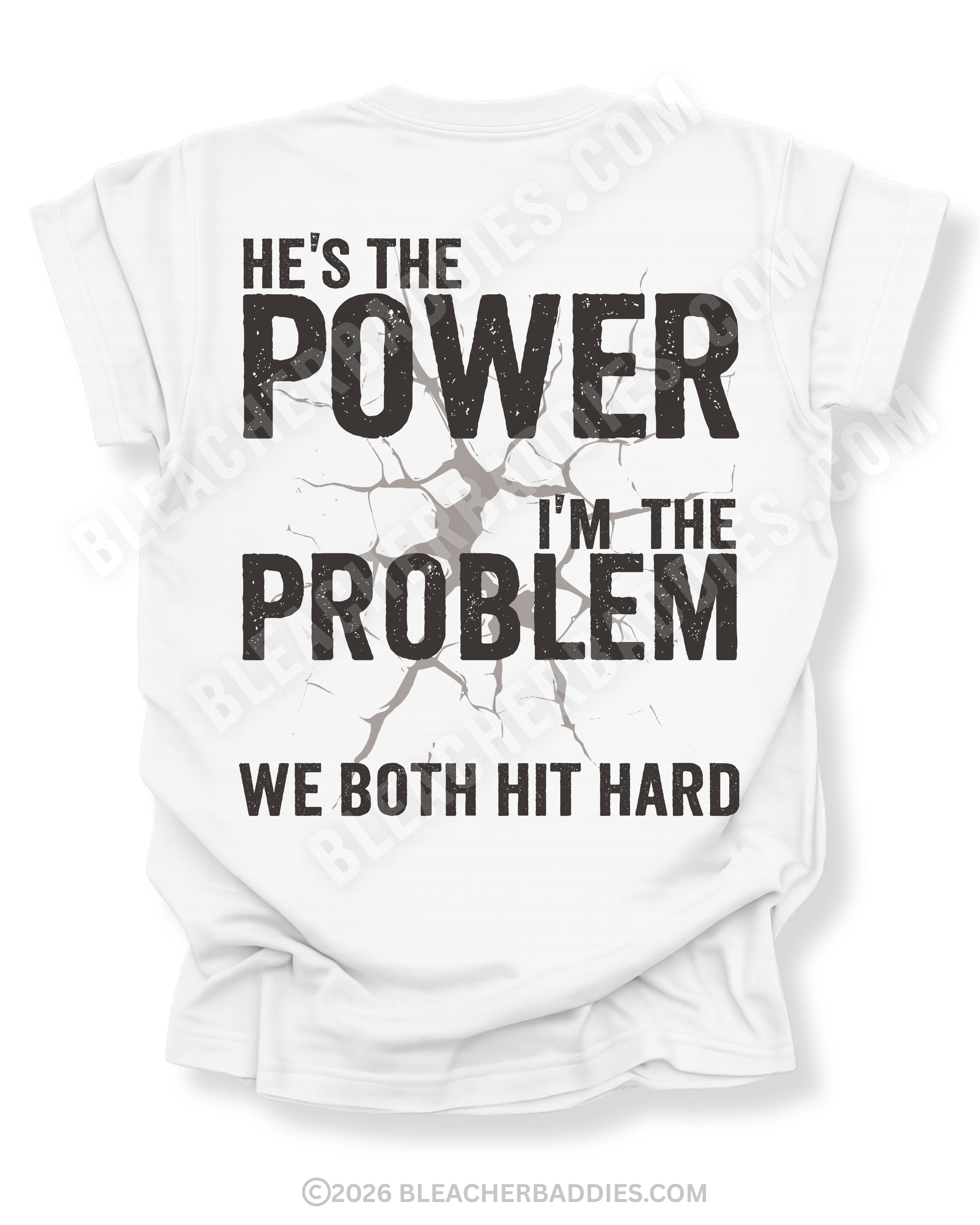 Back view of ivory Comfort Colors football mom game day shirt reading “He’s the Power I’m the Problem We Both Hit Hard,” worn by woman in stadium seating