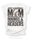 White Comfort Colors game day shirt with distressed back graphic reading “Just a Baseball Mom Who Measures Time in Innings & Weekends in Double Headers” with baseball graphic layered over MOM text