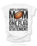 white comfort colors football mom game day shirt with back graphic that says just a football mom who is always just one flag away from a public statement