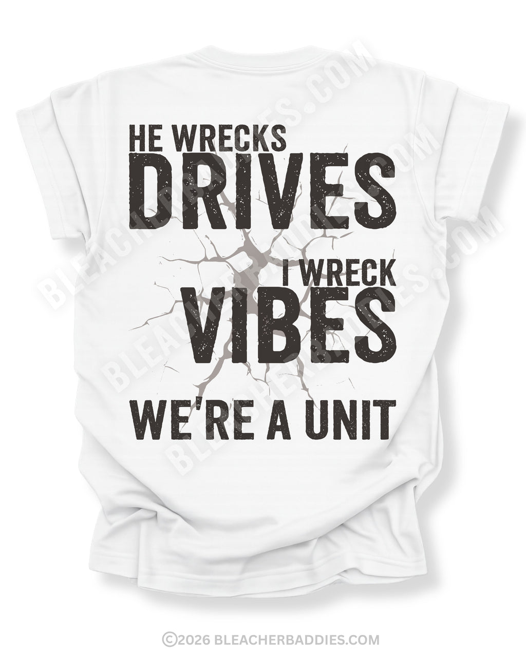 White t-shirt shown from the back featuring a large distressed black graphic that reads “He Wrecks Drives I Wreck Vibes We’re a Unit” with a cracked texture effect.