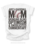 White Comfort Colors game day shirt with distressed back graphic reading “Just a Baseball Mom Bringing Blind Optimism & Unsolicited Commentary” with baseball graphic layered over MOM text