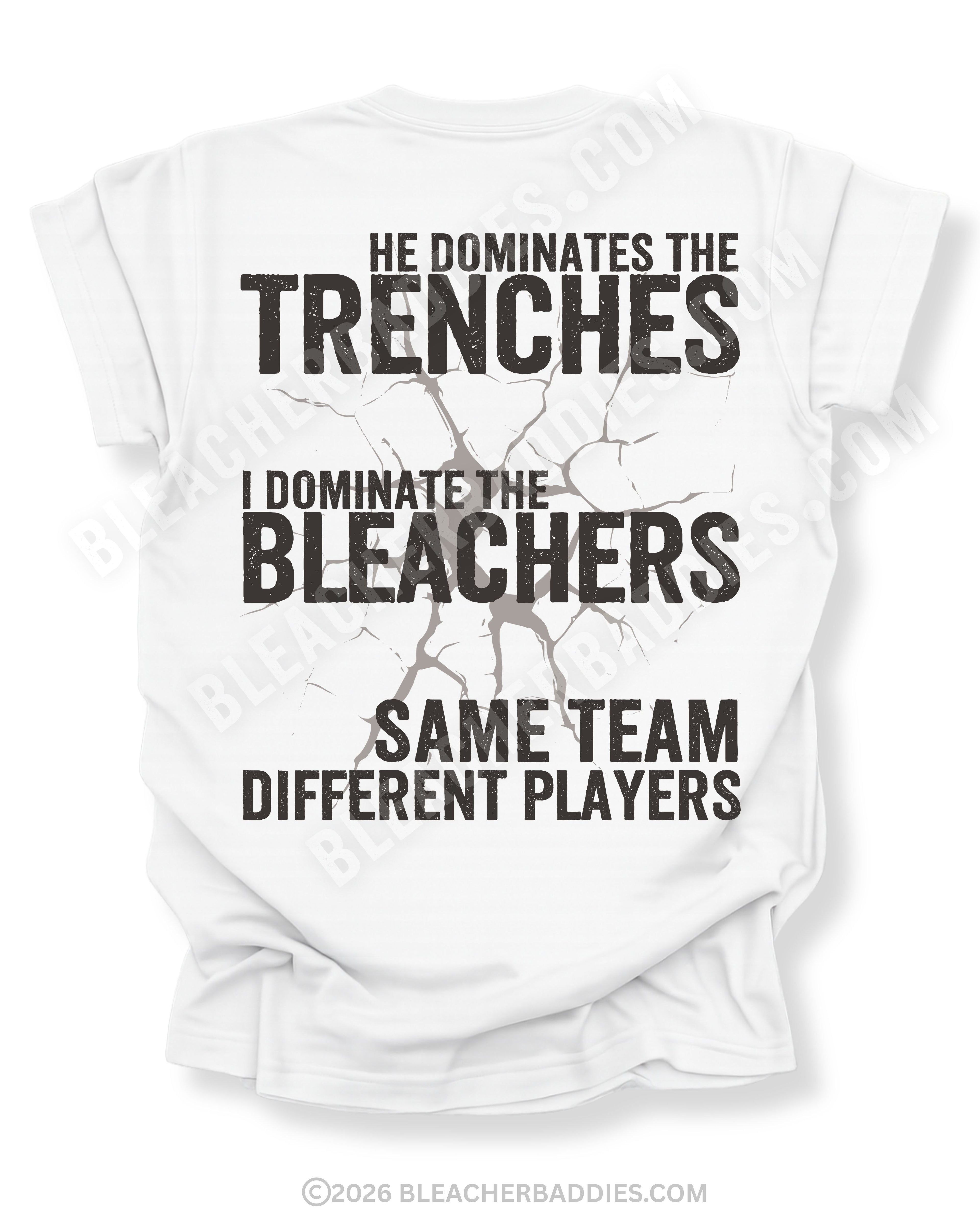 Back of white t-shirt with bold distressed text reading “He Dominates the Trenches I Dominate the Bleachers Same Team Different Players” with cracked graphic detail