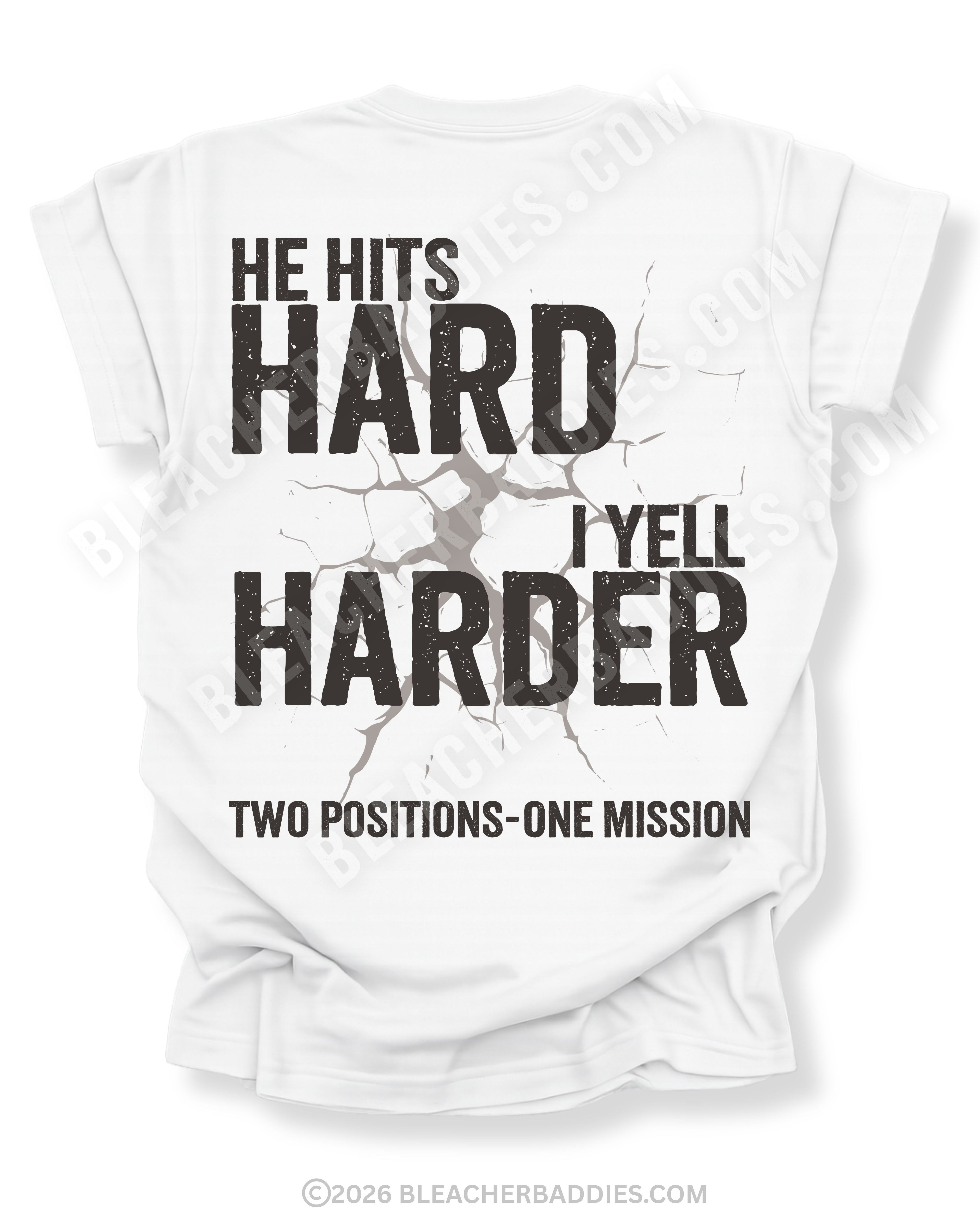 Flat lay of a white Comfort Colors t-shirt featuring the phrase "He Hits Hard I Yell Harder" with a distressed football graphic and "Two Positions One Mission" printed on the back.