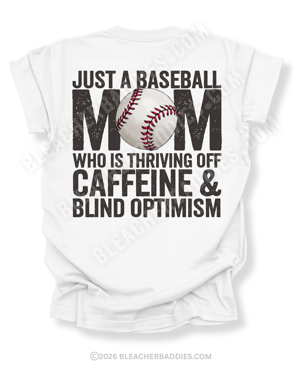 White baseball mom graphic tee featuring distressed black text reading “Just a baseball mom who is thriving off caffeine and blind optimism” with baseball graphic centered in the word MOM