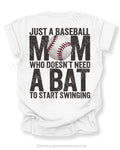 White Comfort Colors game day shirt with distressed back graphic reading “Just a Baseball Mom Who Doesn’t Need A Bat To Start Swinging” with baseball graphic layered over MOM text