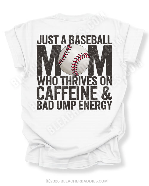 White Comfort Colors game day shirt with distressed baseball mom back graphic reading “Just a Baseball Mom Who Thrives on Caffeine & Bad Ump Energy” with baseball graphic layered over MOM text