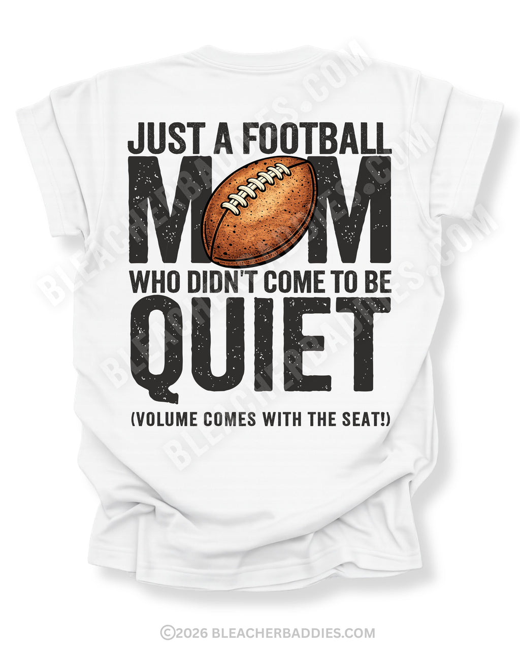 Football mom game day shirt flat lay on white Comfort Colors tee featuring bold back graphic that reads “Just a football mom who didn’t come to be quiet volume comes with the seat”