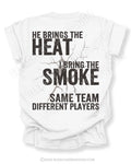 White Comfort Colors shirt with distressed text reading “He Brings The Heat I Bring The Smoke Same Team Different Players.”