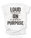 White t-shirt shown from the back featuring a large distressed black graphic that reads “Loud I Paid for My Seat On Not For My Silence Purpose” with a cracked texture effect.