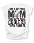 White Comfort Colors style baseball mom game day shirt with distressed black text reading “Just a baseball mom who owns more coolers than purses” and baseball graphic replacing the O in MOM