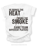 Back of white t-shirt with bold distressed text “He Brings the Heat I Bring the Smoke Same Team Different Players” and cracked graphic detail