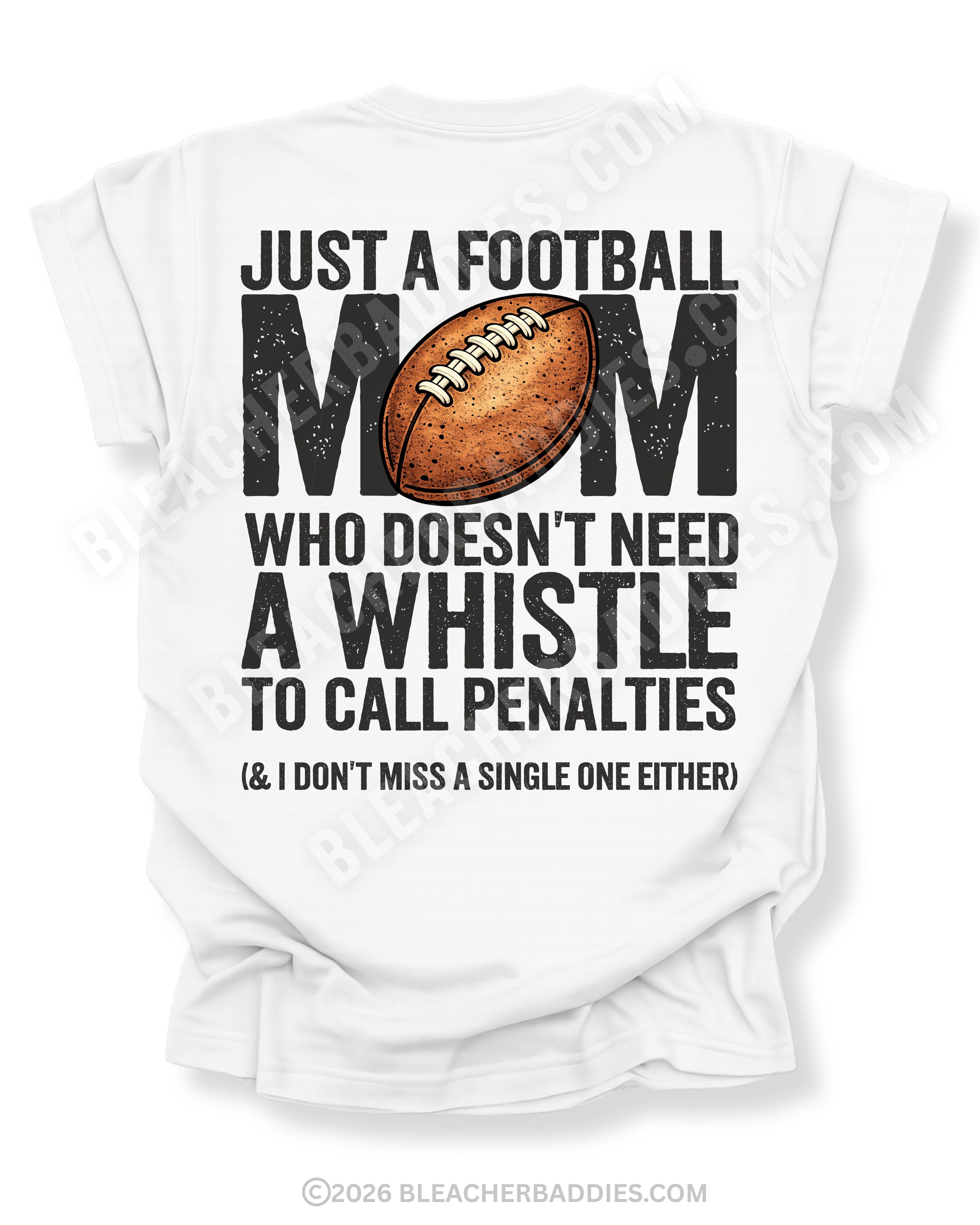 Football mom game day shirt flat lay on white Comfort Colors tee featuring bold back graphic that reads “Just a football mom who doesn’t need a whistle to call penalties and I don’t miss a single one either”