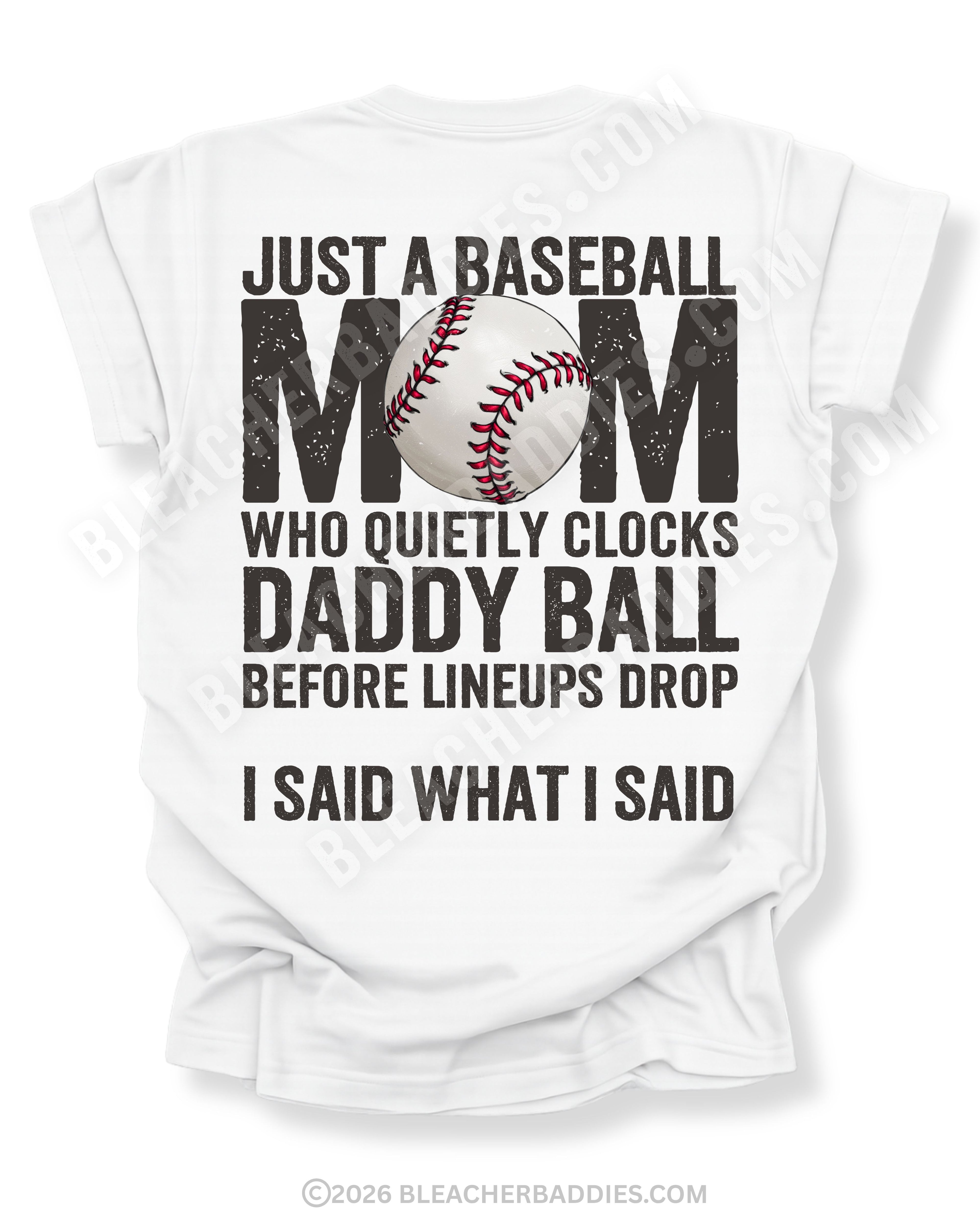 White Comfort Colors game day shirt with distressed back graphic reading “Just a Baseball Mom Who Quietly Clocks Daddy Ball Before Lineups Drop I Said What I Said” with baseball graphic layered over MOM text