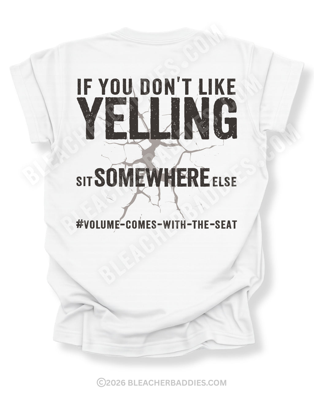 White t-shirt shown from the back featuring a large distressed black graphic that reads “If You Don’t Like Yelling Sit Somewhere Else #Volume Comes With the Seat” with a cracked texture effect.